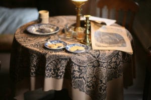 American Civil War newspaper rests on a table set with coffee and cookies