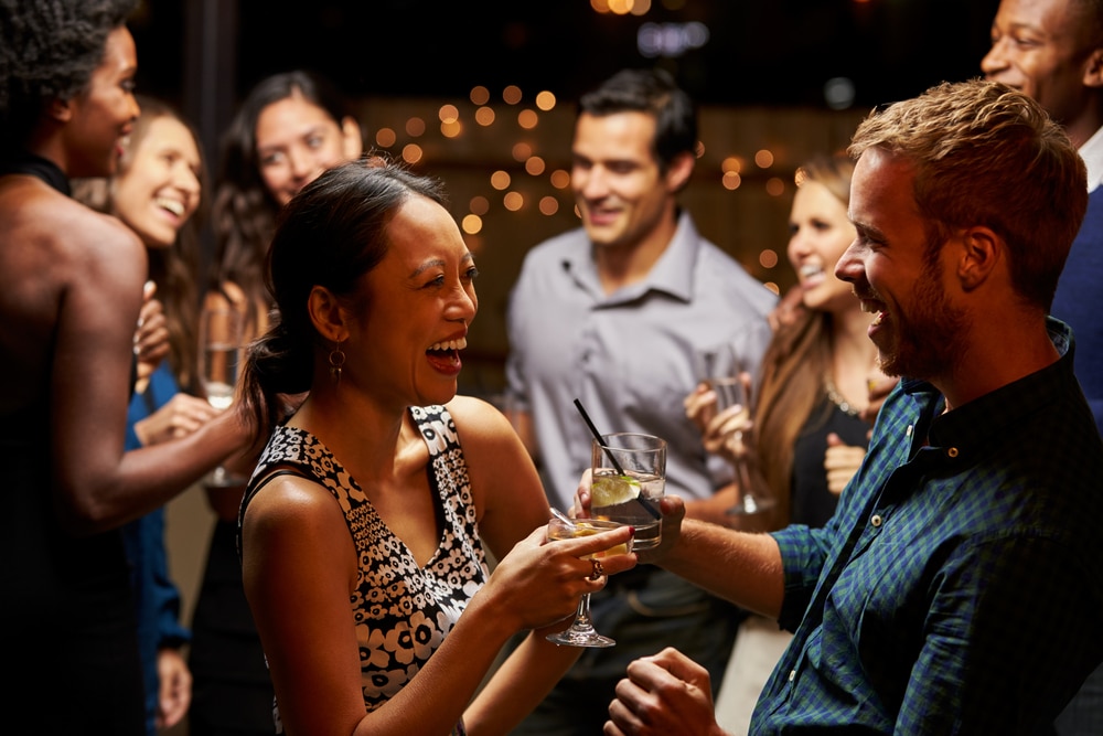 Things to do in Kansas City, a happy couple enjoying drinks and dancing