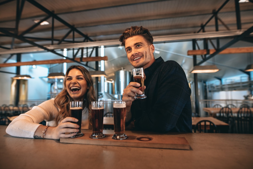 Couple enjoying a flight of Boulevard Beer at Boulevard Brewing Company in Kansas City.