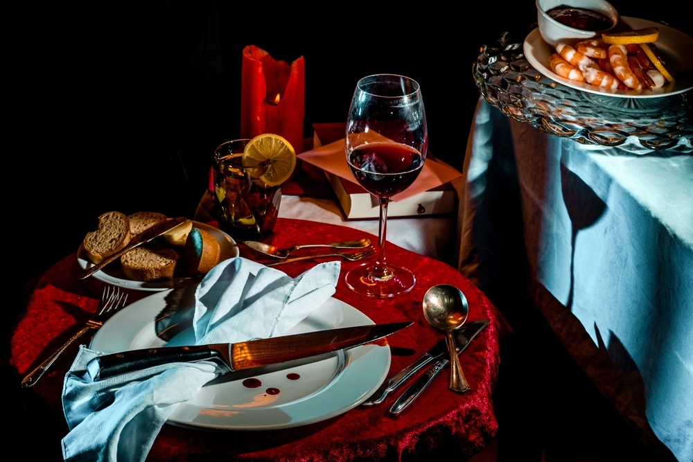 Place setting with bloody knife for Murder Mystery Dinner at one of the most unique places to stay in Missouri.